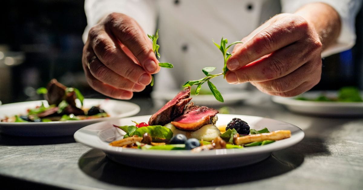 Stock image of a chef preparing food