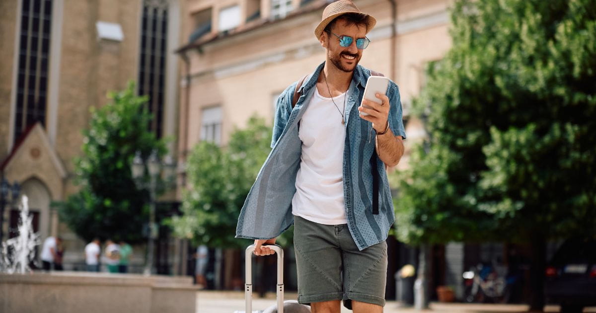 Man using his smartphone abroad