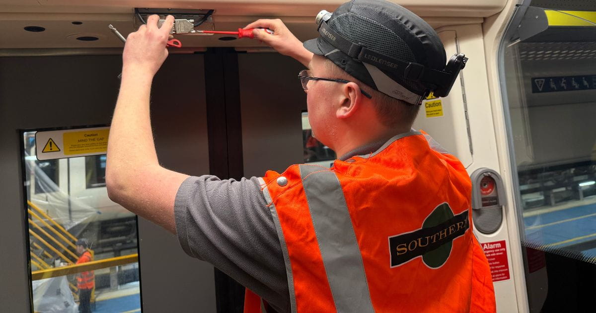Engineer carrying out repairs on a Southern train
