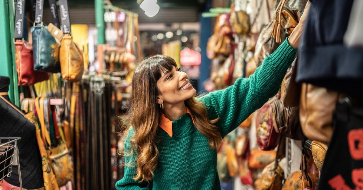 woman browsing a vintage clothing shop
