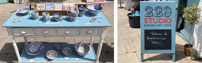 A table with decorative plates, and the sign of a shop