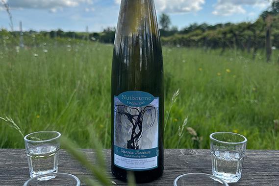 A wine bottle on a table outdoors