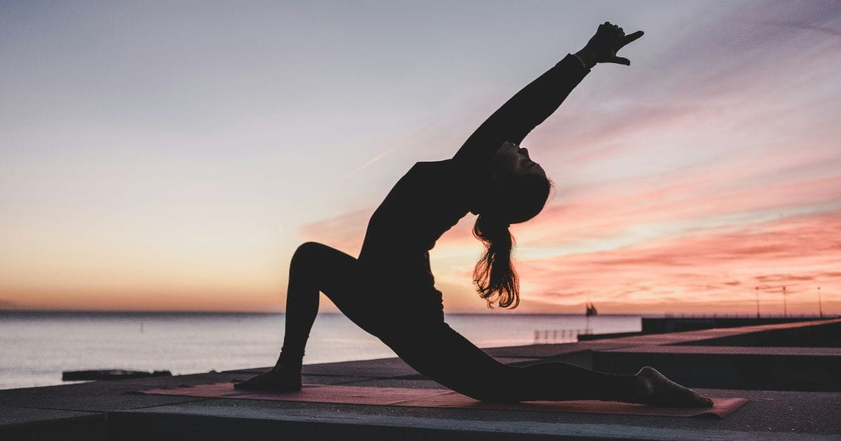 Silhouette of a woman doing yoga