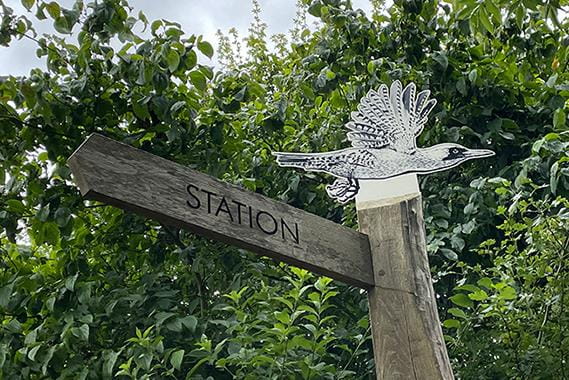Country gate with a driveway to a house