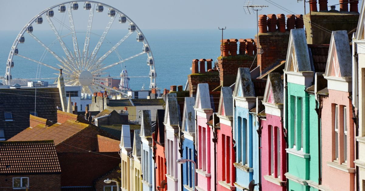 Colourful houses with the Brighton wheel in the background