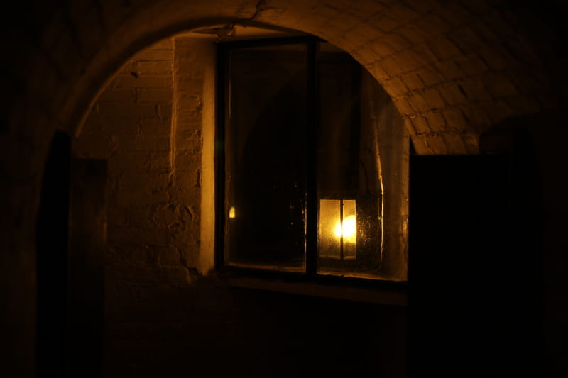 a fireplace in a dark room