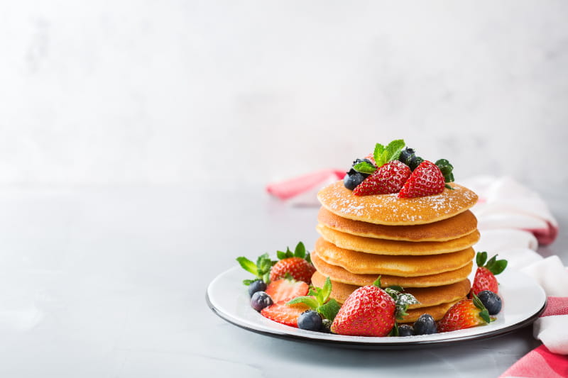 a cake with fruit on a plate