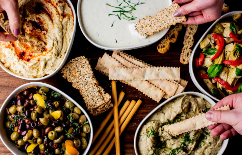 a box filled with different types of food on a plate