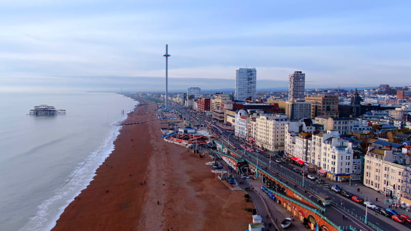 a body of water with a city in the background