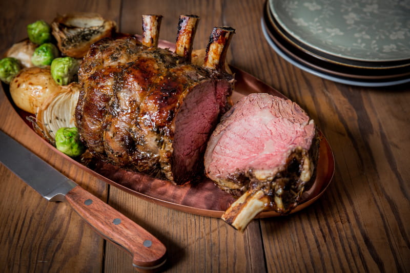 a plate of food on a wooden table