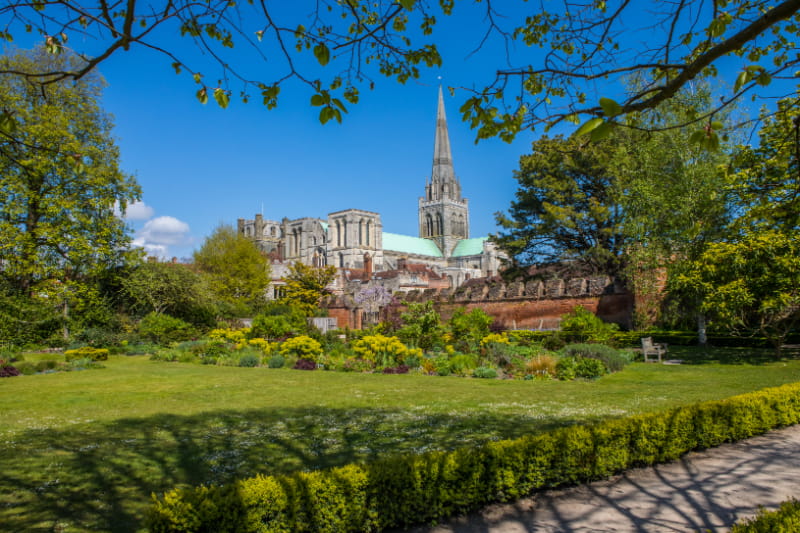 a castle on top of a lush green field