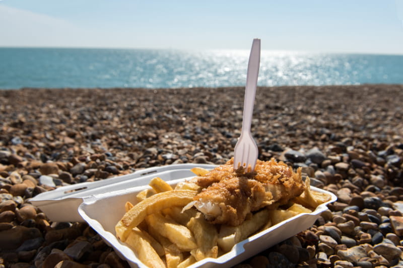 a tray of food on a beach