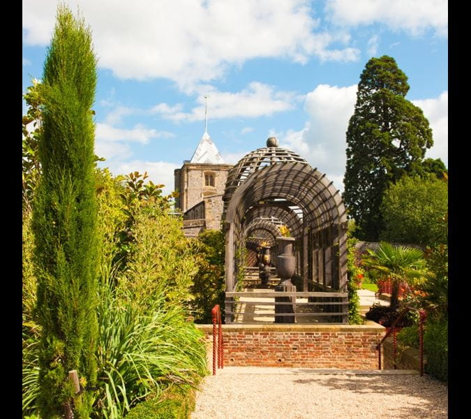 a statue of a person in a garden