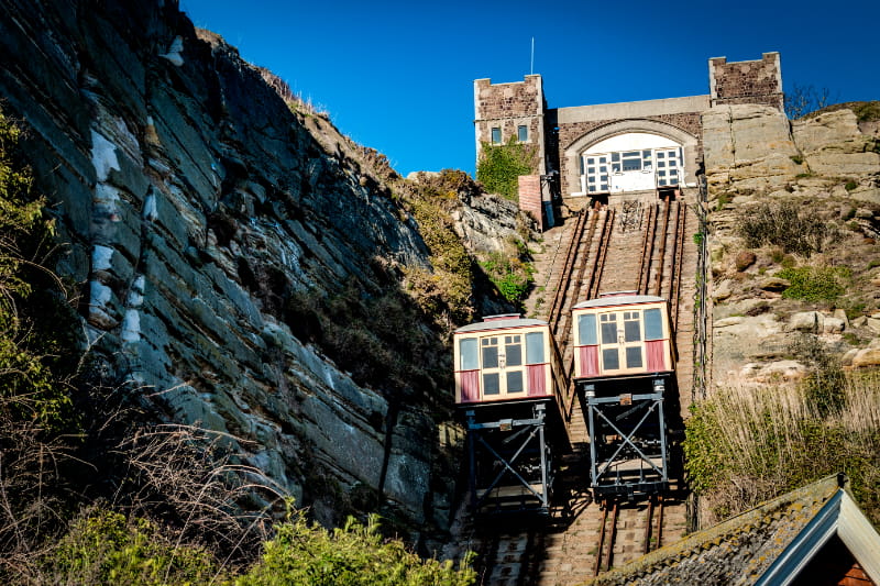 a train sitting on the side of a mountain