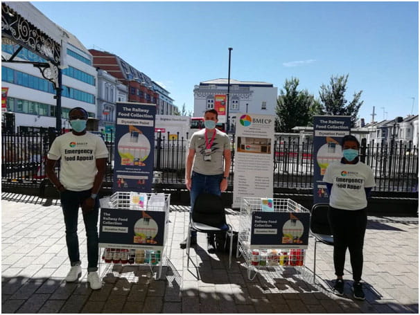 a group of people standing in front of a building