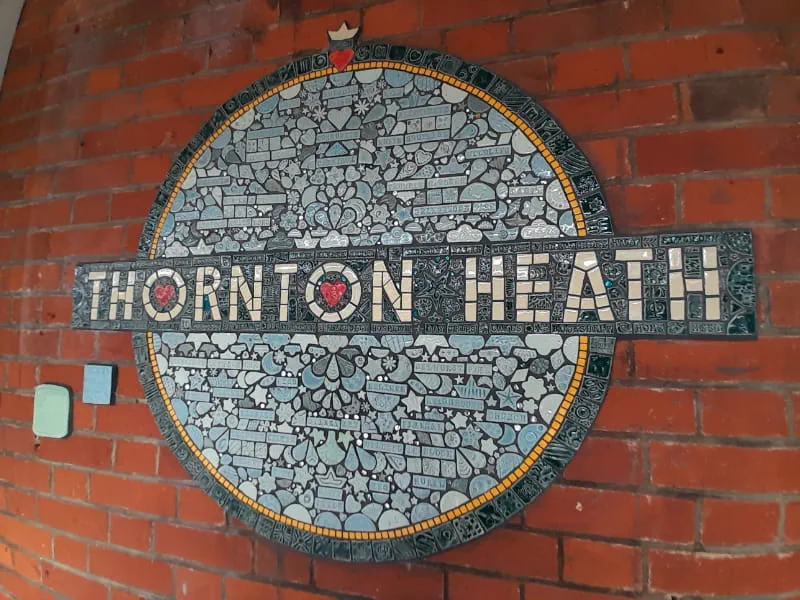 a sign on the side of the face of a brick building