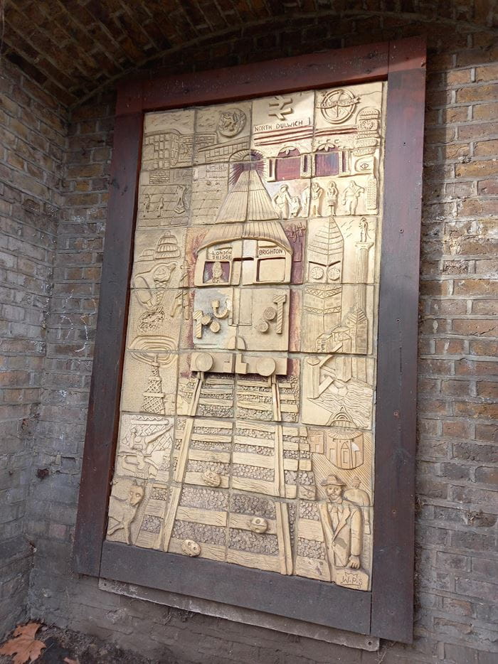a sign on the side of a brick building