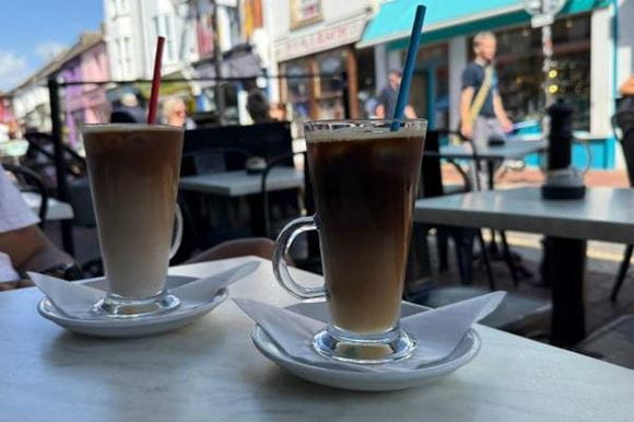 Two coffees on a table at a coffee shop in Brighton