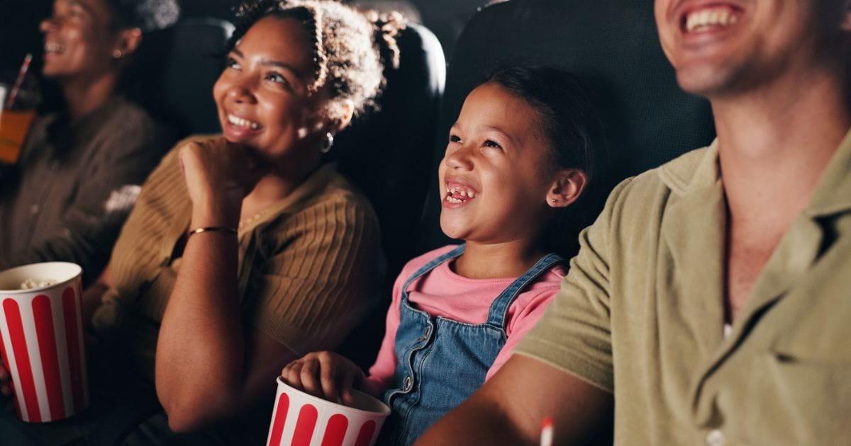 Family watching a film at the cinema