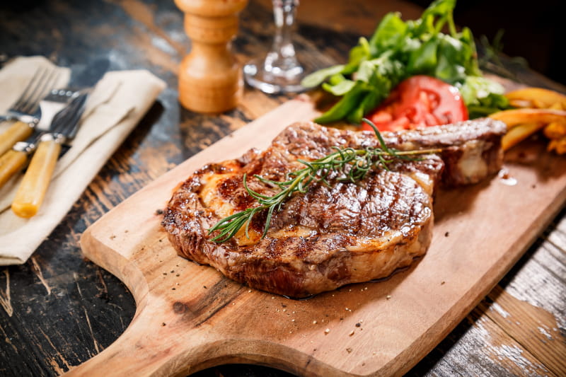food sitting on top of a wooden cutting board