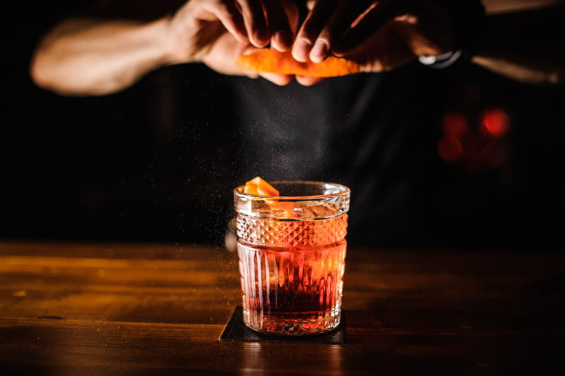a glass drink on a table