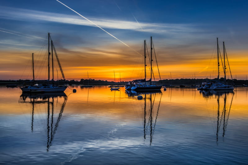 a sunset over a body of water