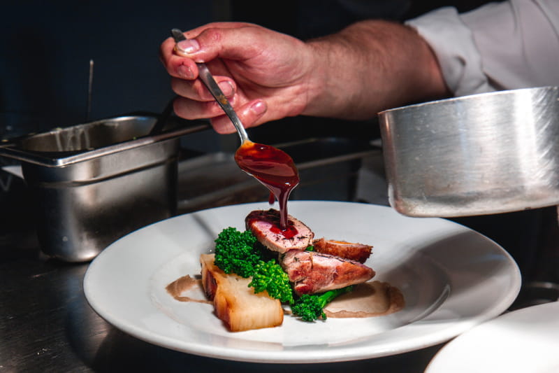 a person holding a plate of food