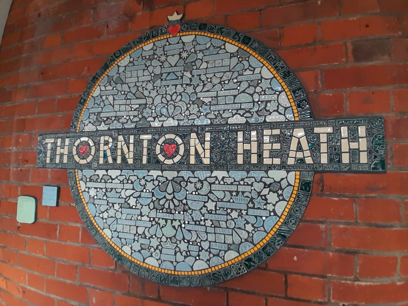 a sign on the side of the face of a brick building